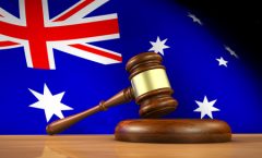 Gavel in front of an Australian flag.