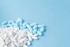 Blue and White Medications on a Blue Background