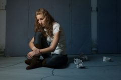 Teenage Girl Alone on Floor
